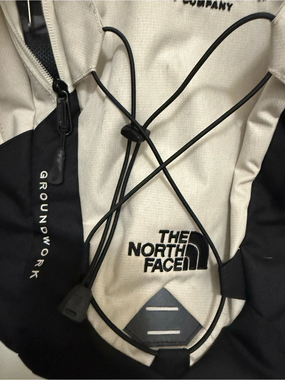 The North Face Two-Tone Beige and Black Backpack with Bungee Front